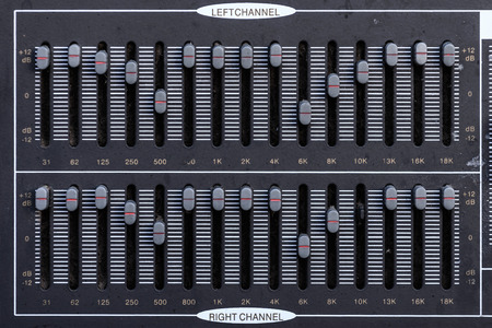 Old equalizer audio sound mixer control panel.