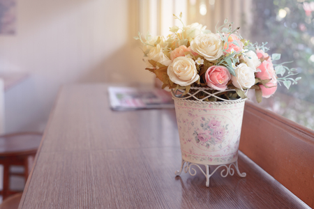 Beautiful decoration artificial flowers on wooden bar.の写真素材