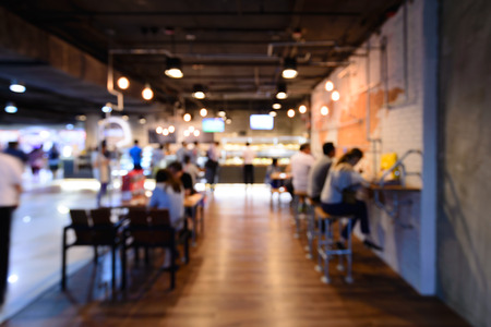 Blurred peoples drinking and relax in coffee shop.の写真素材