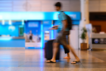 Blurred of travllers walking in airport lounge.の写真素材
