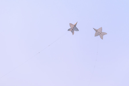 Flying star-shaped kite, Popular Thai traditional culture in summer.の写真素材