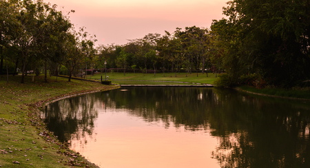 Beautiful urban lake in middle of city at sunset.の写真素材