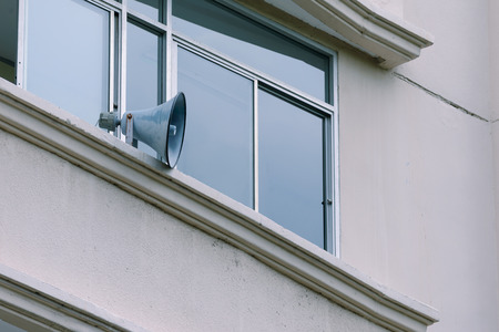 Speakers on building for announcement broadcasting.の写真素材