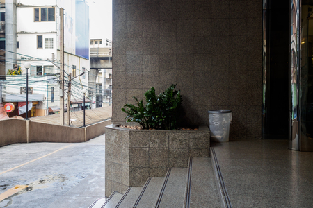 Trashcan near building stair keeping garbage.の写真素材