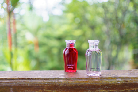 Shower gel bottle place on table with nature background.の写真素材