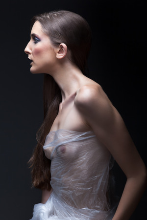 portrait of beautiful model in plastic dressの写真素材