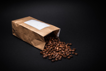 fresh coffee beans in a bagの写真素材