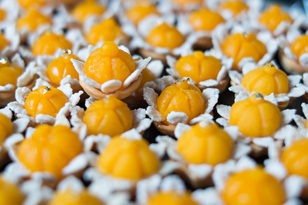 Thai dessert called Kanom Jamongkut a kind of crown-like yellow sweetmeat mainly made of yolk and...