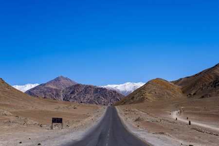The long straight road to Magnetic Hill a famous place located near Leh, Ladakh, Jammu and Kashmir, India.の写真素材