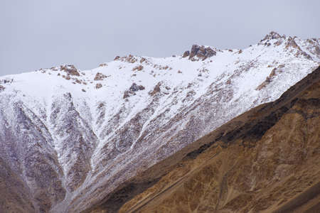 Snow-covered mountains near Pangong Lake or Pangong Tso located in Ladakh, Jammu and Kashmir,...