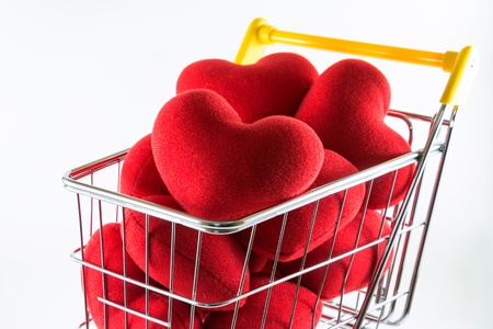 Closeup many red hearts in shopping cart の写真素材