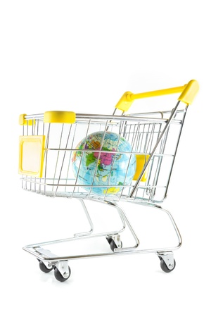 Globe model in shopping cart on white backgroundの写真素材