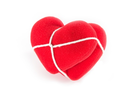 Red heart tied together 