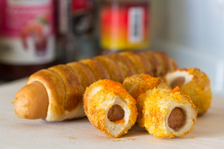 Roll bread sausage on plate wood の写真素材
