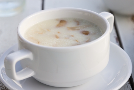 Creamy mushroom soup served in cup の写真素材