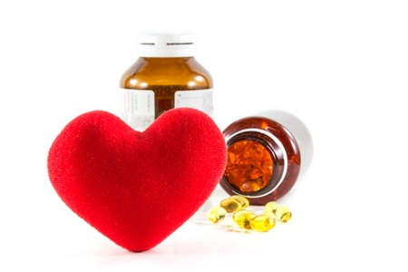 Heart shape and pills with bottles の写真素材