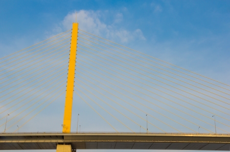 Pillar and sling bridge in line の写真素材