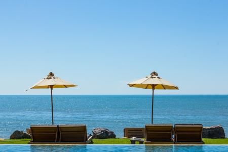 Two beach chairs on sea view in blue sky の写真素材