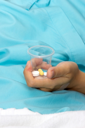 Patient hold the pill in bottle の写真素材