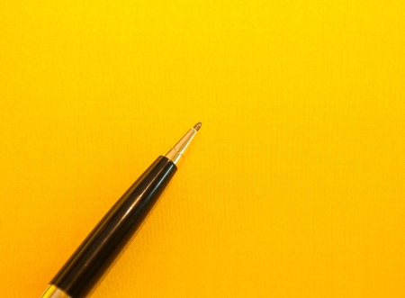 Luxury pen on yellow background の写真素材