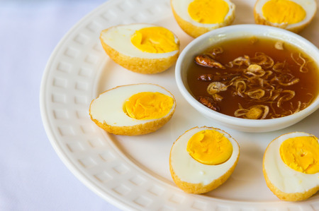 Boiled eggs fried with a sweet sauce の写真素材