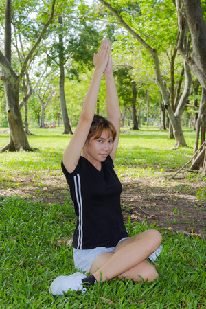 Young women exercise with stretching her arms の写真素材