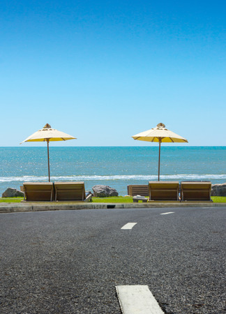 The street and beach chair on sea view の写真素材