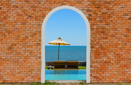 Sea view inside on the brick wall の写真素材