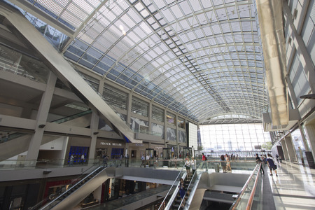 Singapore - October 23, 2014: Outlet in Marina Bay Sands shopping center and Modern building around Marina Bayのeditorial素材
