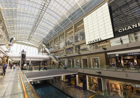 Singapore - October 23, 2014: Outlet in Marina Bay Sands shopping center and Modern building around Marina Bayのeditorial素材