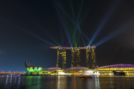 Marina Bay, Singapore - October 23, 2014: Across Marina Bay Sands Hotel during an evening light of the wonderful show.のeditorial素材