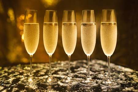 glasses with champagne on a black background.Vintage toneの写真素材