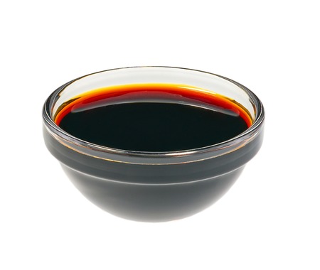 Small glass  bowl of  soy sauce  isolated on white backgroundの写真素材