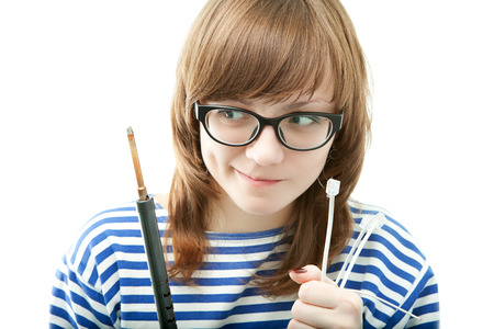 The girl on a white background. The girl with a wire in a hand.の写真素材