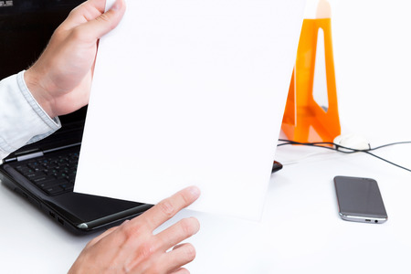 Mister in his hand holding a model release document for signature.の写真素材