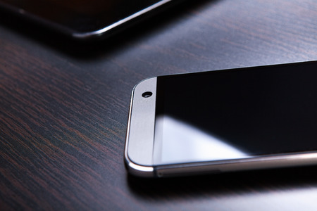 Mobile phone on the table and the camera lights up.
