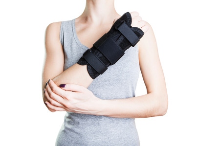 Pain in the wrist, and the retainer for a quick recovery.の写真素材