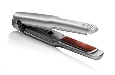 hair straightener isolated on white の写真素材