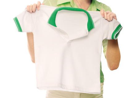 Hands holding a white clean shirt の写真素材