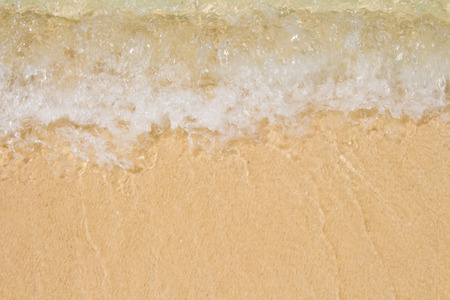Soft wave of the sea on the sandy beachの写真素材