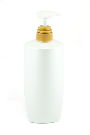 White plastic bottles for cosmetic creams, lotions, shampoo and gels with colored capsの写真素材