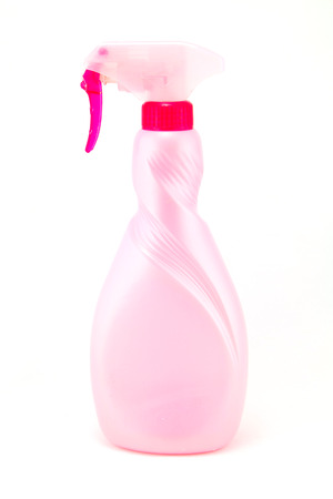 A bright green spray bottle on white backgroundの写真素材