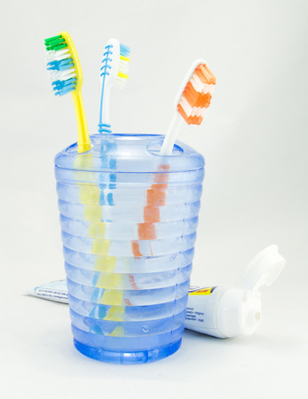 Several toothbrush put in storage and toothpasteの写真素材