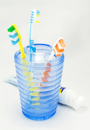 Several toothbrush put in storage and toothpasteの写真素材
