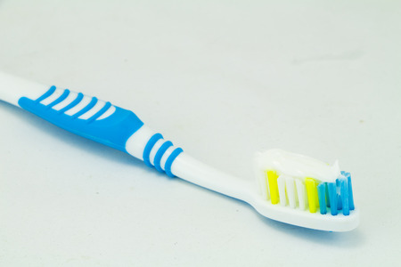 Toothbrush with toothpaste isolatedの写真素材