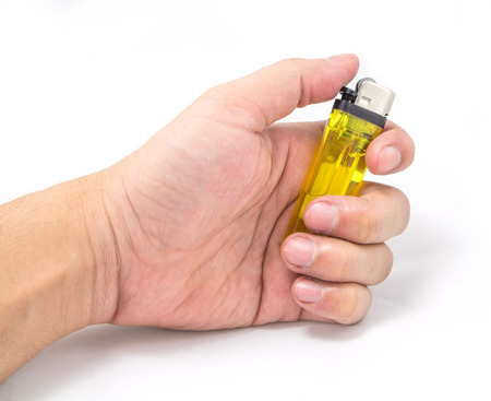 Hand holding Plastic lighter colorful isolated on white Backgroundの写真素材