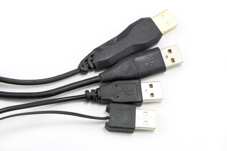 Many USB cable on white background isolatedの写真素材