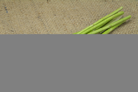 Organic Asparagus on sack background