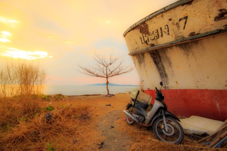 Wreck fishing boat has been placed on the beach.の写真素材