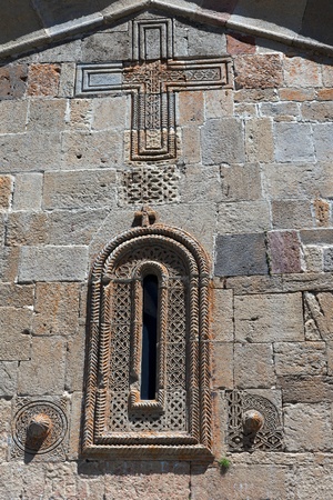 Stone carving on the wall of medieval Gergeti (Trinity) church. Near Stepantsminda (formerly...